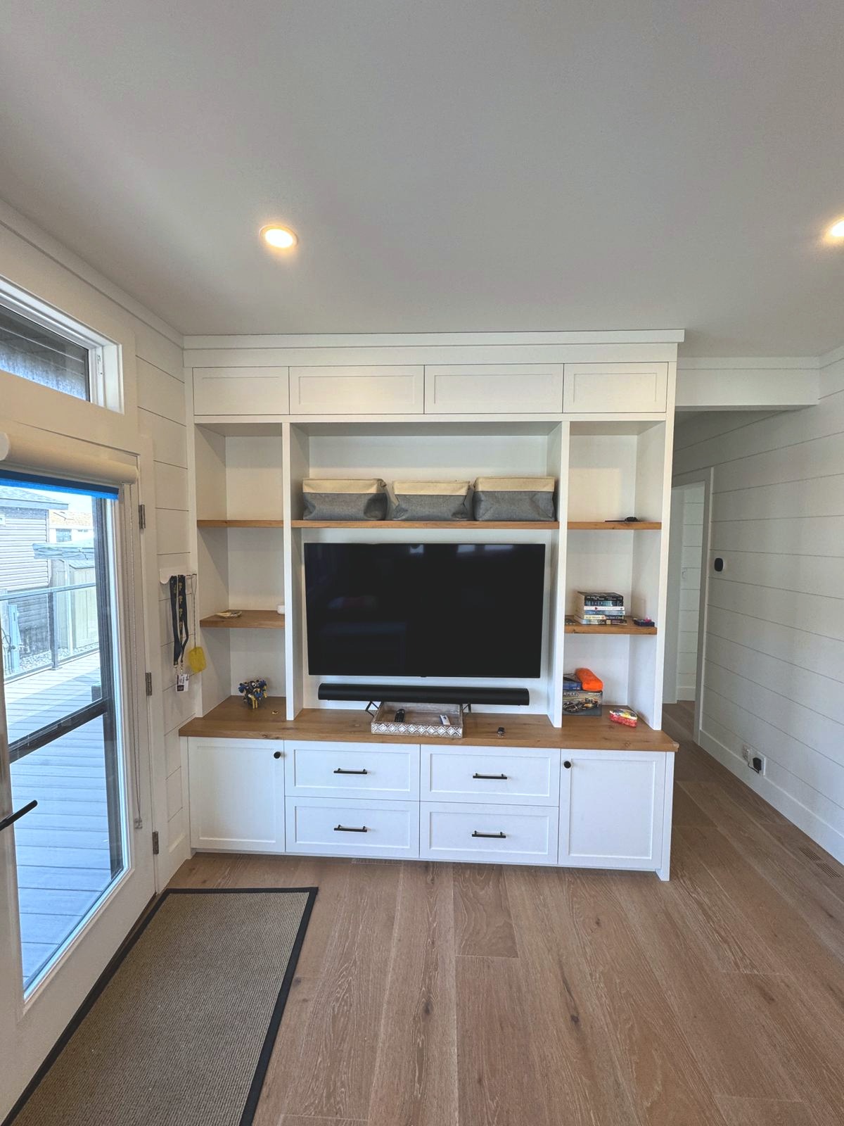 Custom media built-in with floating wood shelves