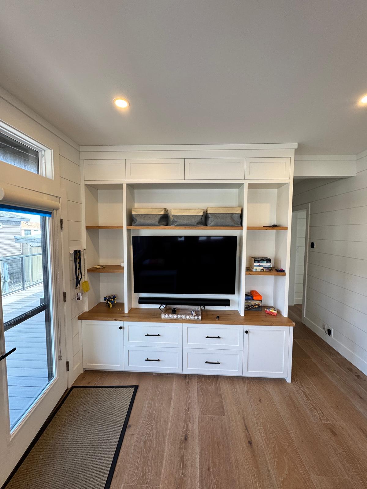 Custom media built-in with floating wood shelves