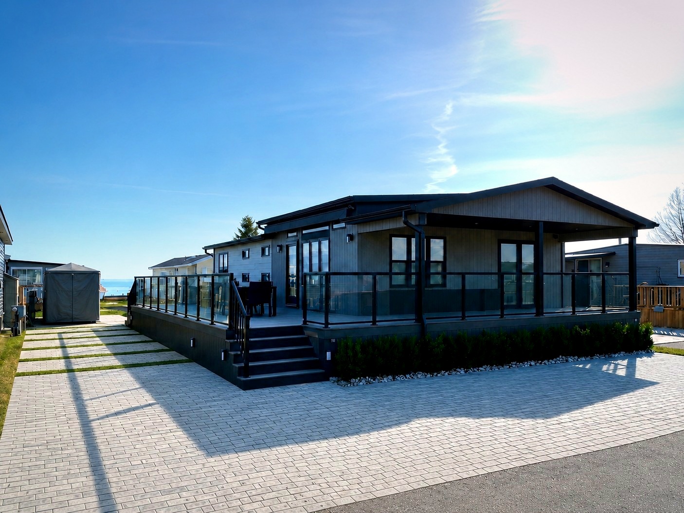 12 Pebble Lane — front exterior of luxury cottage with wrap-around deck at Sherkston Shores